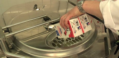 Adding milk to mashed potatoes