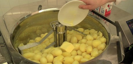 Peeled potatoes in mixer kettle