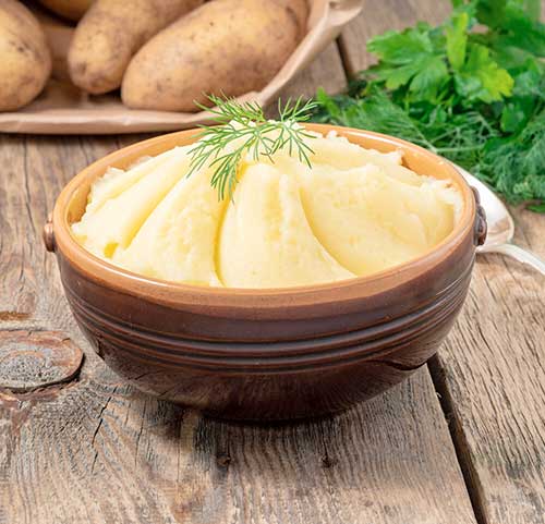 mashed-potatoes-boiled-puree-in-brown-bowl-on-dar-2023-11-27-05-26-25-utc